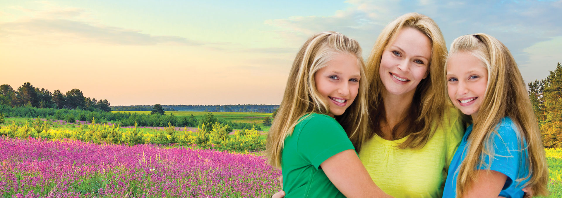 mother and daughters in a country scape